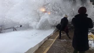 Watch Amtrak Train Create Crazy Wave of Snow While Pulling Into Station [upl. by Carrelli]